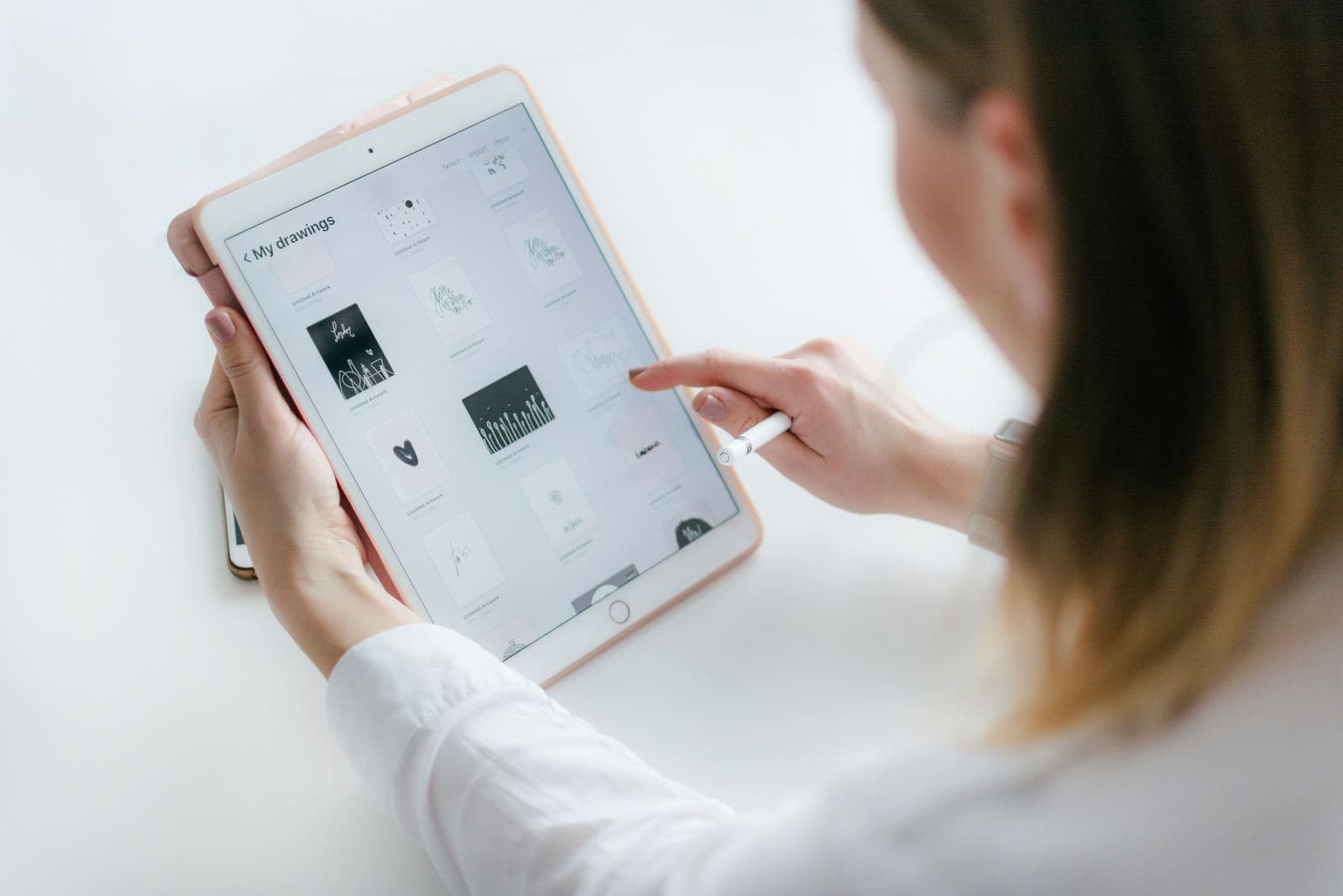 Browsing a gallery of artwork thumbnails on an iPad